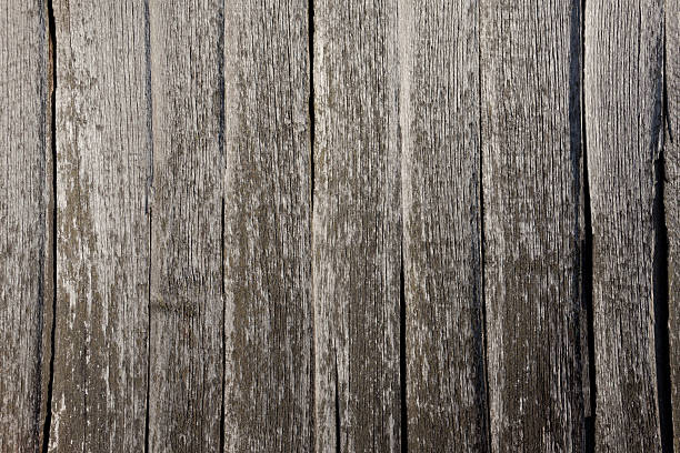 istock weathered wooden barn - facade shingles in sunlight 462332051