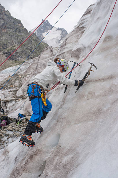 istock Girl climb up on the ice 462333711