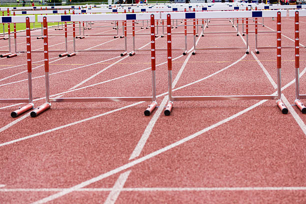 istock hurdles on the  running track 462334371