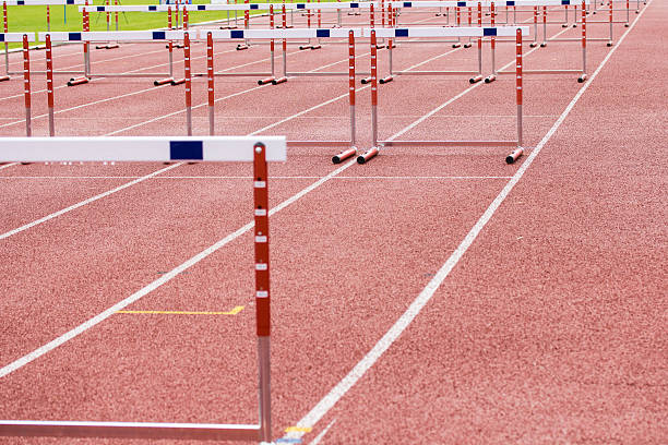 istock hurdles on the  running track 462334381