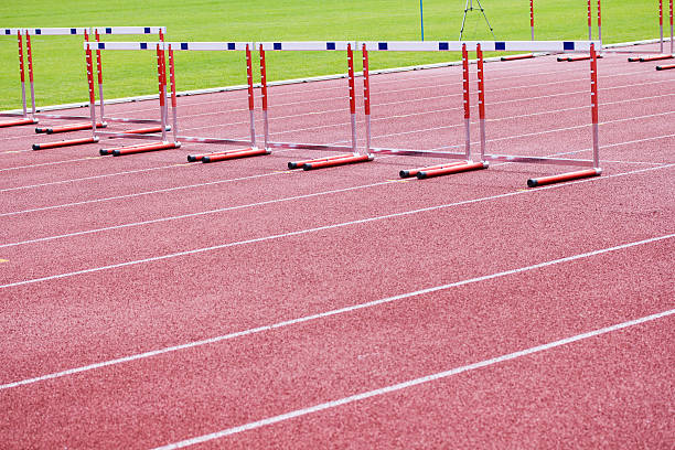 istock hurdles on the  running track 462334407