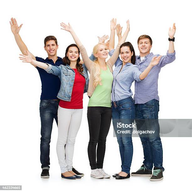 Group Of Smiling Students Waving Hands Stock Photo - Download Image Now - Group Of People, Waving - Gesture, Greeting