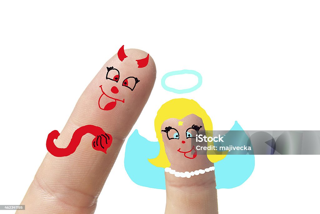 devil and angel Painted devil with angel on her finger. Angel Stock Photo