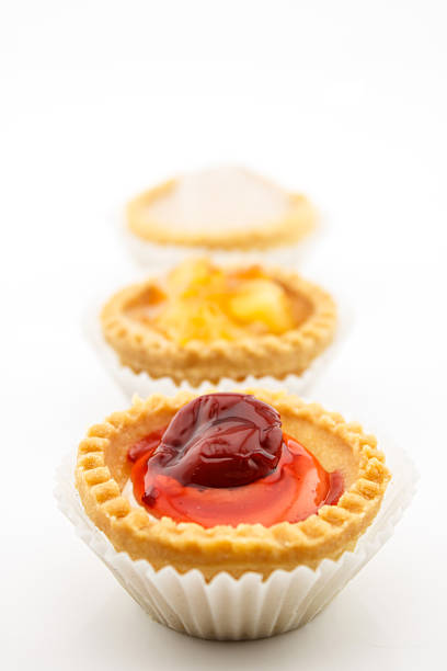 mini tart with red cherry jam isolated on white background