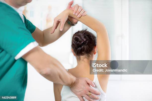 Physical Therapist Series Shoulder Mobility Stock Photo - Download Image Now - Chiropractic Adjustment, Osteopath, 35-39 Years