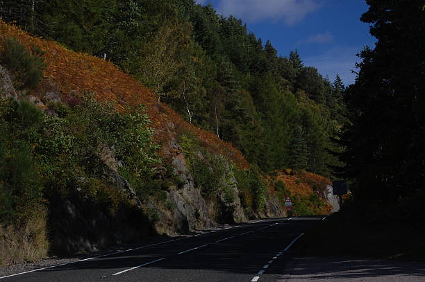 Autumn colours near Inverness Main A82 road on the west side of Loch Ness just south of Inverness and north of Drumnadrochit in September. drumnadrochit stock pictures, royalty-free photos & images