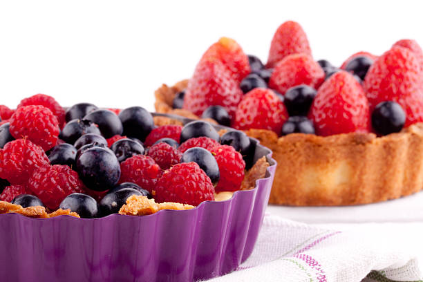 istock raspberry,blueberry and strawberry tarts 462351425