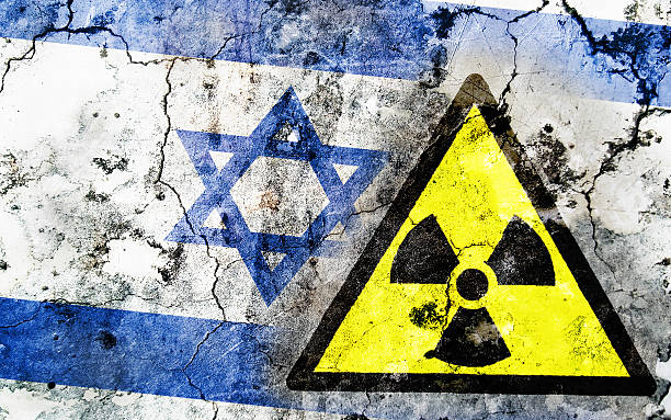 istock Old cracked wall with radiation warning sign and painted flag 462351911