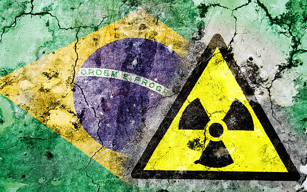 istock Old cracked wall with radiation warning sign and painted flag 462352653