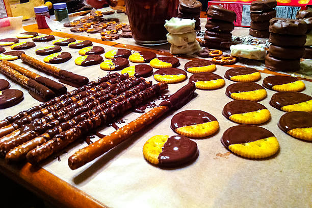 Chocolate dipped crackers and pretzel snacks stock photo