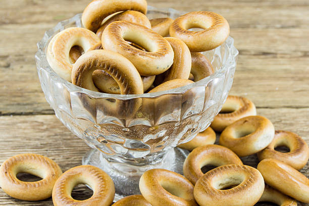 istock Closeup of group assorted bagels on a wood table 462359947