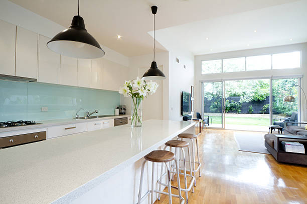 Contemporary kitchen living room Contemporary kitchen and open plan living room with garden aspect streaky lights stock pictures, royalty-free photos & images