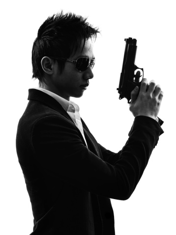 one asian gunman killer portrait in silhouette white background