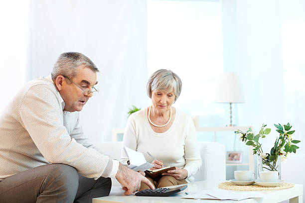 istock A senior couple budgeting with a use of a calculator 462365365