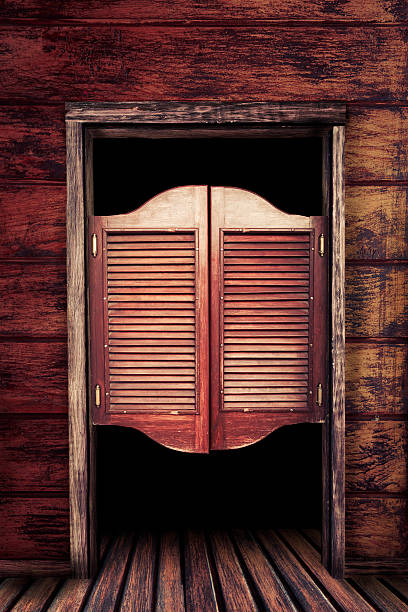 Old vintage wooden saloon doors Old western swinging Saloon doors saloon photos stock pictures, royalty-free photos & images