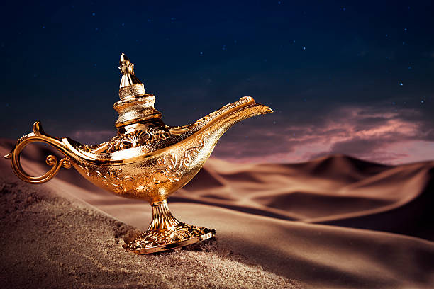 Magic Aladdin's Genie lamp on a desert Aladdin magic lamp on a desert magic lamp photos stock pictures, royalty-free photos & images