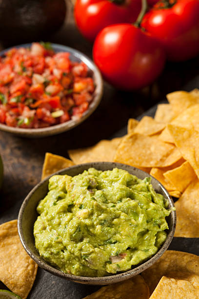 istock Green Homemade Guacamole with Tortilla Chips 462368445