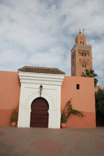 View of the woman’s door and minaret of Koutoubia Mosque in Marrakech, Morocco, Africa.