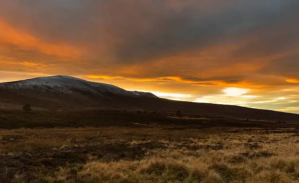 This is Ben Rinnes, the high point of malt whisky and Moray, Scotland, United Kingdom at sunset on a December night.