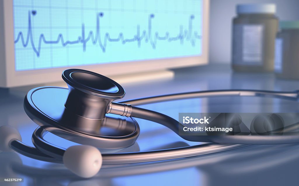 Stethoscope Exam Stethoscope in front of the heartbeat monitor. Capsule - Medicine Stock Photo