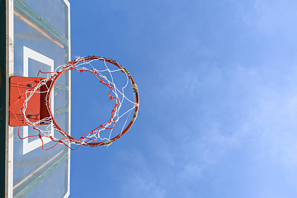 istock Basketball hoop against the warm summer sky 462376145