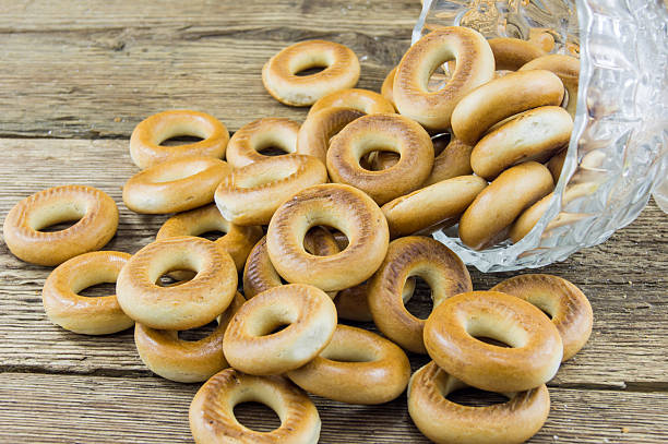 istock Closeup of group assorted bagels on a wood table 462376231