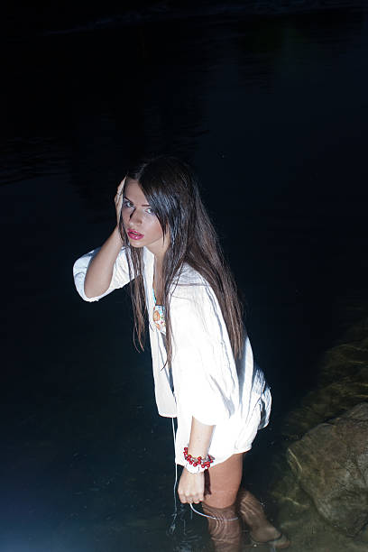 istock Beautiful young woman in the river 462382449