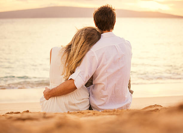 istock Young couple in love on the beach sunset 462382489