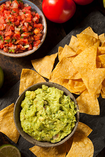 istock Green Homemade Guacamole with Tortilla Chips 462384127