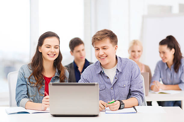 istock students with laptop and notebooks at school 462388173