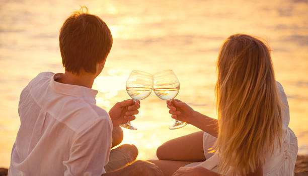 istock A couple toasting with wine on their honeymoon 462388223