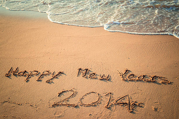 istock Writing Happy New Year's 2014 on the Beach in Thailand 462389521