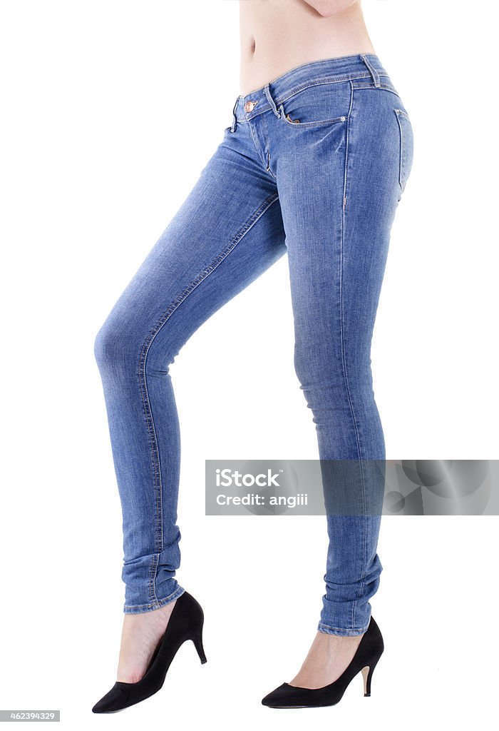 Woman legs in jeans Woman legs in jeans with white background Women Stock Photo