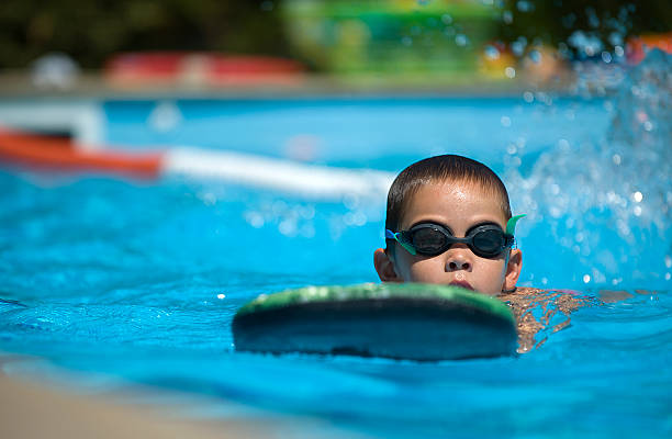 Boy practice swimming stock photo