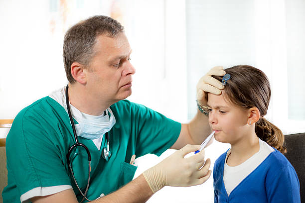 istock Doctor measuring temprature 462398017