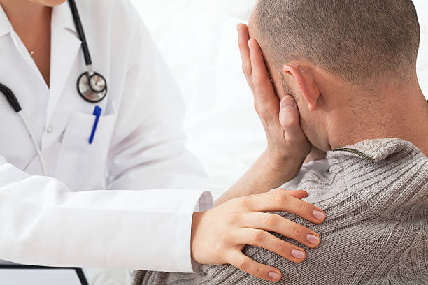 istock Doctor comforting a patient 462398481
