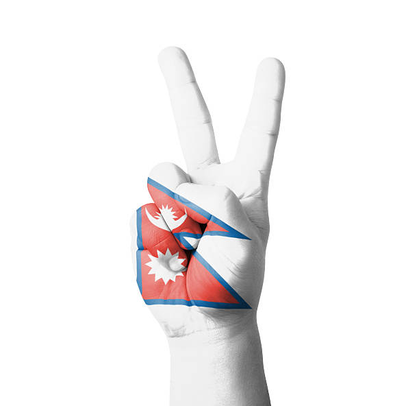 Hand making the V sign, Nepal flag painted