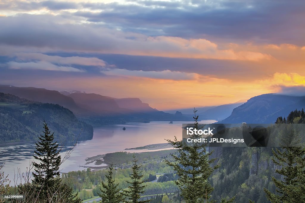 Sunrise Over Crown Point at Columbia River Gorge Sunrise Over Vista House on Crown Point at Columbia River Gorge in Oregon with Beacon Rock in Washington State Oregon - US State Stock Photo