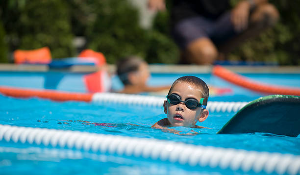 Boy practice swimming stock photo