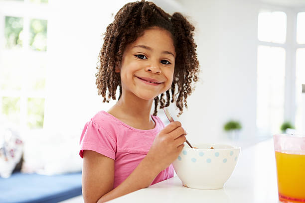 istock Young Girl Having Breakfast In Kitchen 462402467