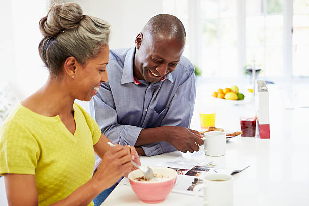 istock Senior couple having breakfast and reading magazine 462403991