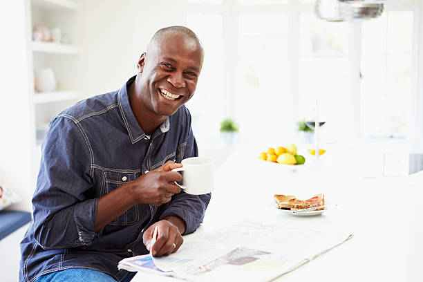 istock African American Man Eating Breakfast And Reading Newspaper 462404171