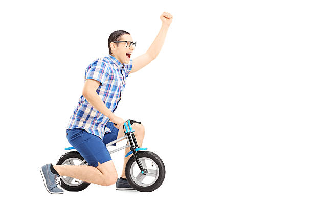 istock Excited guy riding bicycle and gesturing happiness 462408491