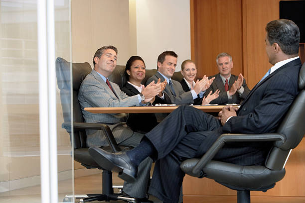istock Businesspeople Applauding Boss In Meeting 462411059