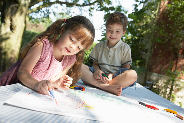 istock Kids Drawing On Outdoor Table 462413935