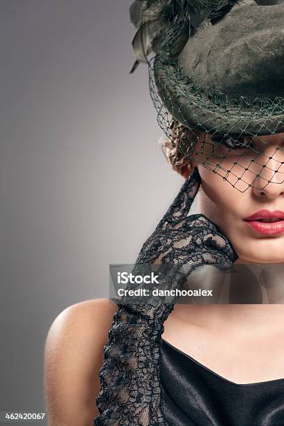 Closeup Shot Of A Woman Wearing Vintage Gloves And Hat Stock Photo - Download Image Now