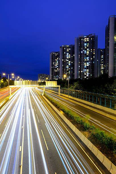 istock traffic with blur light through city at night 462424021