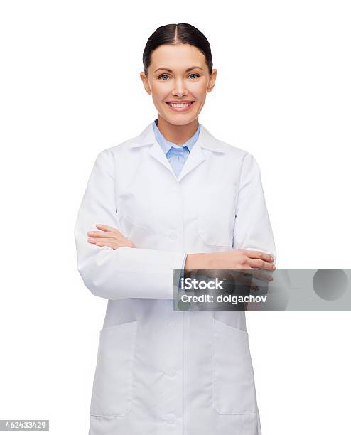 Young Happy Female Doctor With Her Arms Crossed Stock Photo - Download Image Now - Lab Coat, Doctor, Cut Out