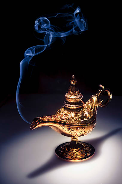 istock Magic Aladdin's Genie lamp on black with smoke 462434495