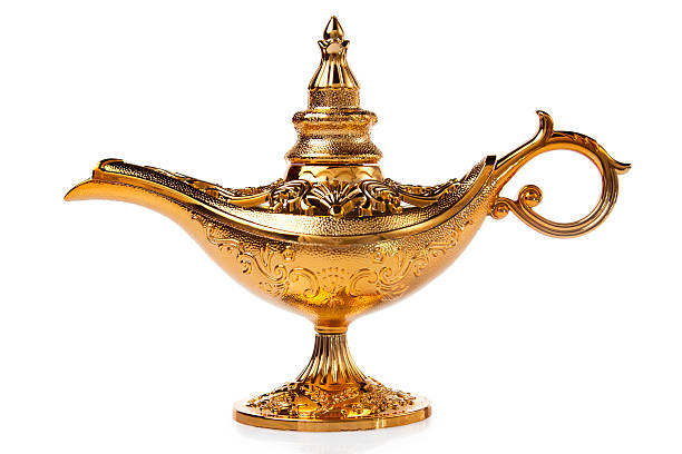 волшебный aladdin's genie лампа изолирован на белом - aladdin стоковые фото и изображения